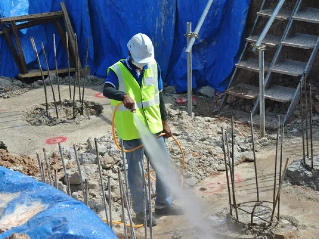 depositphotos_81052874-stock-photo-construction-workers-spraying-the-anti